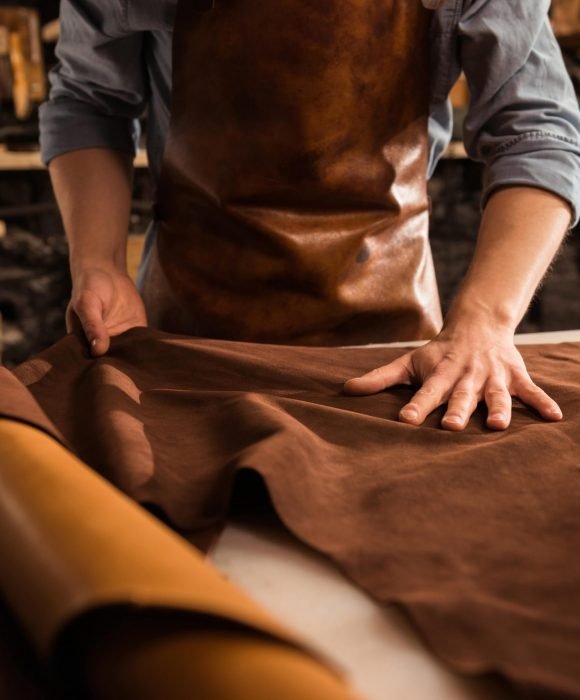 close-up-cobbler-working-with-leather-textile-min-1